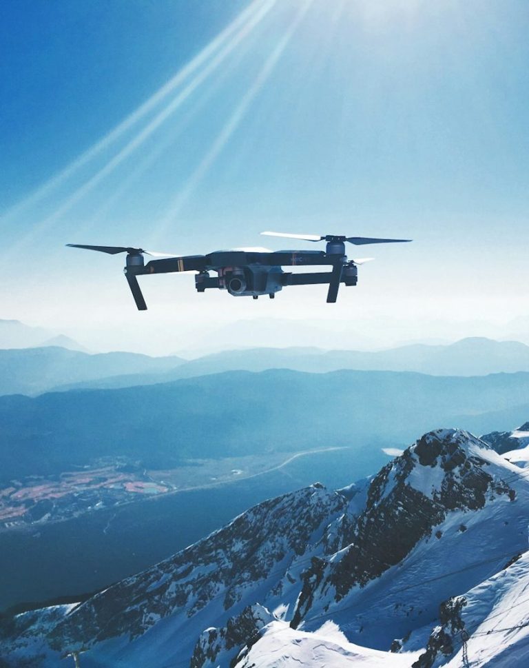Global Security Education Two armed officers in tactical gear apprehend a restrained man in an indoor setting.